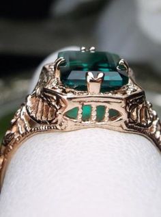 Natural Green Emerald 10k or 14k Rose Gold RingLovely Rectangle Design#D148 Make heads turn and stand out with this gorgeous piece of jewelry! This Edwardian reproduction filigree ring is made from rose gold and features an emerald cut high quality natural emerald gemstone measuring 9mm by 7mm. From the beautiful intricate floral daisy design to the inside of the band marked 10K or 14K for gold – this ring will take your look to the next level! Look no further than this exquisite vintage-inspire Luxury Rose Gold 14k Gold Emerald Ring, Unique Emerald Cut Yellow Gold Jewelry, Unique Yellow Gold Emerald Cut Jewelry, 14k Rose Gold Emerald Ring, Elegant 14k Rose Gold Jewelry With Emerald Cut, Rectangular Rose Gold Jewelry With Prong Setting, Elegant 14k Rose Gold Emerald Cut Jewelry, Formal Rose Gold Emerald Jewelry, Unique 14k Gold Emerald Cut Jewelry