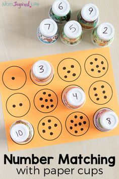 a number matching activity with paper cups for kids to practice numbers and counting on the table