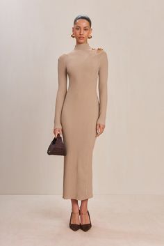 A long-sleeve ribbed knit maxi dress with a mock neck and left shoulder cut out detail. — Maxi length — Ribbed knit — Left cutout shoulder detail — Mock neck Bridal Tops, Knit Maxi Dress, Cult Gaia, Shoulder Cut, Maxi Knit Dress, Women Wedding Guest Dresses, Ladies Dress Design, Kids' Dresses, Shopping List