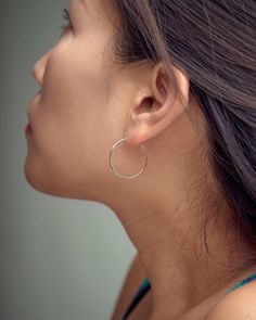 "These gold hoop earrings are the perfect addition to your minimalist earring collection. Our gold fill hoops are meant to be classic enough for everyday wear or to give as a bridesmaid gift. These trendy earrings will definitely be a favorite of yours! SOLD AS A PAIR ** PLEASE NOTE: The model is wearing multiple earrings. This listing is for a pair of Gold Hoop earrings only ** At LunaiJewelry, we take pride in the details and love we pour into everything we make. We know you'll find something Nickel Free Circular Earrings, Hoop Wrap Earrings For Gift, Nickel-free Hoop Earrings For Wedding, Small Hoop Hypoallergenic Earrings For Wedding, Hypoallergenic Small Hoop Earrings For Wedding, Hypoallergenic Hoop Earrings For Weddings, Silver Earrings Simple, Tiny Gold Hoop Earrings, Bridesmaid Earrings Silver