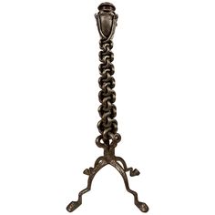 an ornate metal candle holder with chains hanging from it's sides, on a white background