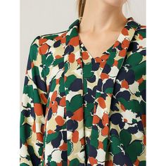 This floral top has a retro floral print for an easy-to-style look, and the soft chiffon fabric lends a comfortable, soft feel. Style it with your favorite jeans or skirts for a casual and chic look. Whether you're in the office or out on the town, this floral print blouse is perfect for any occasion. You will look fierce yet feminine in this lightweight woven blouse with a burgundy, black, and yellow floral print. The model is wearing an X-Small. Floral Print Chiffon V-neck Top, Spring Patterned Viscose Blouse, V-neck Floral Print Viscose Blouse, V-neck Viscose Blouse With Floral Print, Floral Print Viscose V-neck Blouse, Green Chiffon Tops For Work, Multicolor Floral Print Viscose Blouse, Green Chiffon Tops For Workwear, Spring Green Viscose Blouse