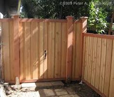 a wooden fence with two gates on each side