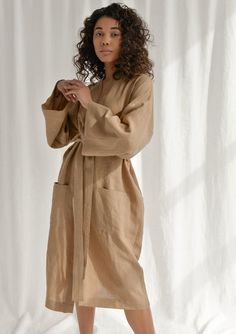 Spoil yourself with a linen bathrobe that's incredibly soft, light, and breathable. Handcrafted of premium quality European linen, this almond kimono-style bathrobe feels so good to the skin, you'll never want to take it off. The linen robe features a relaxed fit, long sleeves, an adjustable waistband, and comfy outer pockets, making it the ultimate addition to your at-home wear. The model is 175 cm (69'') tall and is wearing a bathrobe in size S/M.DETAILS- Handmade from high-quality European li Beige Linen Kimono For Loungewear, Relaxed Fit Beige Robe For Loungewear, Beige Relaxed Fit Robe For Loungewear, Beige Relaxed Fit Kimono For Loungewear, Relaxed Fit Beige Kimono For Loungewear, Beige Linen Kimono For Beach, Beige Linen Beach Kimono, Beige Linen Robe For Spring, Beige Linen Spring Robe