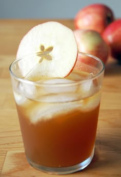 an apple sitting on top of a wooden table