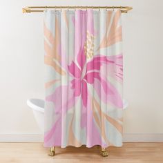 a pink and white flower shower curtain hanging on a wall