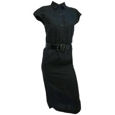 1980s Claude Montana Black Linen Shirtwaist Dress. Snap buttons at front, shirt collar, one front breast pocket. Wide patent leather belt. Dramatic pleated kick pleat. Classic Belted Shirt Dress For Semi-formal Occasions, Chic Belted Shirt Dress For Work, Belted Shirt Dress For Business, Elegant Belted Shirt Dress For Work, Classic Collared Shirt Dress For Business, Formal Button-up Belted Shirt Dress, Black Belted Dress For Work, Classic Pleated Shirt Dress For Office, Classic Collared Belted Dress For Formal Occasions