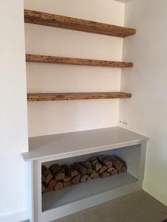 there is a shelf with logs in it