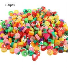 lots of different colored beads and buttons on a white background with the words 100 pcs