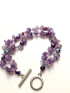 Double strand purple amethyst bracelet with toggle clasp 7 1/2 inches long Adjustable Amethyst Jewelry With Lobster Clasp, Handmade Adjustable Lavender Jewelry, Amethyst Bead Jewelry With Stones, Handmade Purple Multi-strand Bracelets, Handmade Purple Multi-strand Bracelet, Purple Double Strand Natural Stones Jewelry, Purple Double Strand Jewelry With Natural Stones, Double Strand Purple Jewelry With Natural Stones, Handmade Multi-strand Purple Jewelry