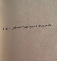 an open book with the words to all the girls with their heads in the clouds