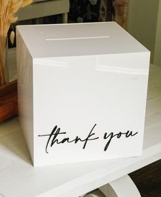 a white box with the words thank you written on it