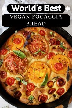 the world's best vegan focaccia bread with tomatoes and basil