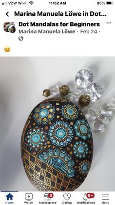 an image of a hand painted purse with beads on the bottom and in the middle