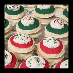 several decorated cookies sitting on top of tin foil