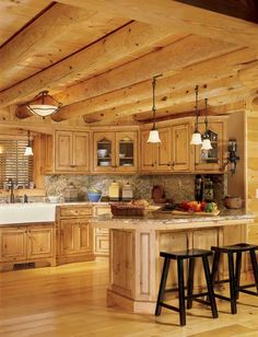 a kitchen filled with wooden cabinets and counter tops