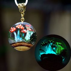 "Mushroom crystal Pendant necklace. Glow in the dark Crystal terrarium necklace. Gift for women. ♥ This item is handmade, so each piece is unique. The piece you receive will be based on this design and very similar to photos. ♥♥ Please see the current discounts in the shop announcement: https://www.etsy.com/shop/TSMDecorations Handmade from natural wood and clear art resin. Real mushrooms and moss were sealed in resin  along with an interesting piece of wood with bark.  Mushrooms are painted lik Handmade Crystal Necklaces For Gifts, Handmade Crystal Necklace Gift, Mystical Luminous Jewelry Gift, Mystical Luminous Jewelry For Gifts, Mystical Clear Jewelry For Gifts, Green Mushroom Design Jewelry Gift, Mystical Resin Necklaces For Gifts, Handmade Mystical Resin Jewelry, Handmade Fantasy Crystal Necklace For Gifts