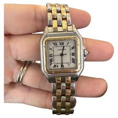 Brand: Cartier Model: Panthere de Cartier Model Number: 187949 Case Material: 18k Yellow Gold / Stainless Steel Case Size: 27 mm Dial: White Bezel: Gold Bracelet: 18k Yellow Gold / Stainless Steel - Two Row Movement: Quartz Year: 1990 Box & Papers: Yes / Yes Panthere Cartier, Vintage Cartier Watch, Cartier Panther, Cartier Watches Women, Tank Watch, Silver Watches Women, Cartier Panthere, Cartier Watch, Two Tone Watch