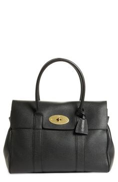 A beautifully structured pebbled-leather satchel features curvy rolled top handles, a neatly notched front flap and a gleaming, logo-etched turnlock. A spacious interior provides plenty of room for storing all of your daily essentials. Turnlock flap closure Rolled top handles Interior zip, wall and smartphone pockets Structured silhouette with flat base and protective metal feet Leather Made in Italy Designer Handbags Leather Satchel With Fold Over Clasp, Leather Top Handle Satchel With Fold Over Clasp, Leather Satchel With Fold Over Clasp And Top Handle, Top Handle Satchel With Fold Over Clasp For Work, Luxury Satchel With Fold Over Clasp And Double Handle, Designer Satchel With Fold Over Clasp And Double Handle, Designer Pebbled Leather Satchel For Office, Classic Leather Shoulder Bag With Fold Over Clasp, Timeless Business Satchel With Fold Over Clasp