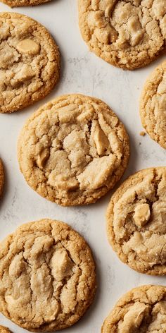 several cookies are lined up on a white surface