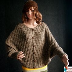 Amazing unusually soft and warm sweater/poncho 2 in 1. It was made from double fiber of baby alpaca wool in beige/brown colour. Very good quallity and luxury fiber and made with attention to details. It is oryginal pattern and design. It comes with buttons Size: L to XL (petite XL) Dimension: length 60 cm, width 70 cm, length of sleeve 79 cm (welt) Alpaca wool is one of the most valuables fibres. Is strong and do not need to be thick to make you warmer. Woven alpaca is water resistant and highly Elegant Oversized Brown Cardigan, Elegant Brown Oversized Cardigan, Brown Knitted One Size Sweater, Brown One-size Sweater, Knitted Brown Poncho For Fall, Hand Knitted Brown Poncho For Fall, Hand-knitted Brown Poncho For Fall, Cozy Brown Alpaca Poncho, Elegant Brown Merino Wool Cardigan