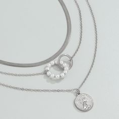 Create a lovely layered look or mix and match this set of silver-plated necklace featuring elegant pearls. Includes three necklaces Chain 1: 13.8" L with 2.7" extender Chain 2: 15.7" L with 2.7" extender Chain 3: 19.7" L with 2.7" extender Lobster claw clasp Silver-plated copper / pearl Three Necklaces, Necklaces Chain, Copper Pearl, Silver Plated Necklace, Layered Look, Silver Pearls, Mix And Match, Lobster Claw, Chains Necklace