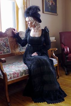 The model is seated on a loveseat looking out a window at the 40 Mile Point Lighthouse. Historical Clothes, Plus Size Costume, Fashion Gowns, Satin Sash