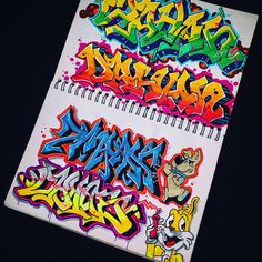 a notebook with graffiti written on it