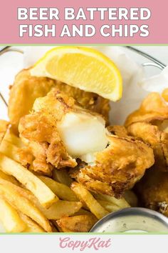 beer battered fish and chips with lemon wedges