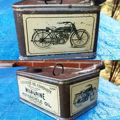 two old tins sitting on top of a blue tarp