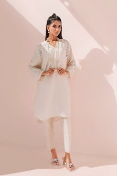 SKU: 3005 Price for Shirt & Trouser 2pc Dreamy and elegant, this masterpiece is made up using soft crepe sikh fabric decorated with cutwork details paired with a classic embroderied pants with sequins finishing adds a hint of elegance to the overall look of this ensemble. Elegant Pant Set With Dabka For Designer Wear, Elegant Designer Pant Set With Dabka Detailing, Elegant Designer Pant Set With Chikankari Embroidery, Elegant Fitted Dabka Pant Set, Elegant Designer Chikankari Embroidery Pant Set, Elegant Pant Set With Resham Embroidery For Eid, Elegant Chikankari Embroidered Pant Set, Elegant Resham Embroidery Pant Set For Eid, Long Sleeve Dabka Pant Set For Eid