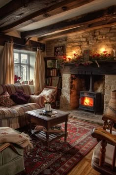 a living room filled with furniture and a fire place in the middle of it's fireplace