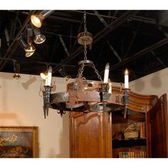 a chandelier hanging from the ceiling in a room