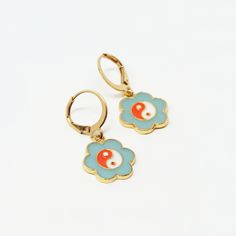 Classic, delicate earrings that lend a nostalgic yet whimsical vibe. Color: Teal, Orange, White, Gold Material: Alloy Dimensions: 1.25"L Overall, 0.5" Pendant Diameter Whimsical Gold Flower-shaped Earrings, Retro Enamel Earrings As Gift, Vintage Brass Hypoallergenic Earrings, Vintage Hypoallergenic Brass Earrings, Retro Hypoallergenic Earrings For Gift, Hypoallergenic Vintage Brass Earrings, Retro Flower Shaped Earrings For Gift, Retro Flower Shape Earrings For Gift, Retro Flower-shaped Earrings For Gift