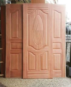 two wooden doors sitting next to each other