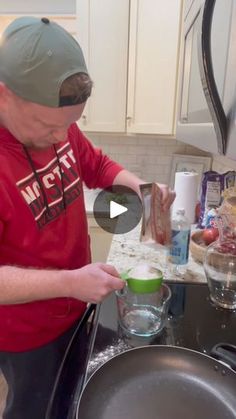 a man is preparing food in the kitchen