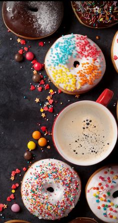 donuts and coffee on a table with sprinkles