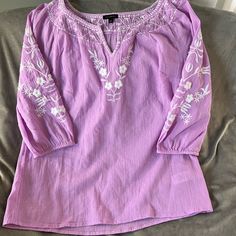 Brand New Without The Tags(I Accidentally Pulled The Tag Off) Light Violet And White Trim Beautiful Lightweight Flowy Boho Embroidered Blouse. Brand New Without Tags Excellent Condition 100% Cotton Spring Vacation Embroidered Shirt, Purple Casual Embroidered Top For Spring, Casual Purple Embroidered Top For Spring, Spring Purple Embroidered Cotton Top, Purple Floral Embroidery Top For Spring, Casual Purple Blouse With Floral Embroidery, Summer Purple Tops With Floral Embroidery, Casual Embroidered Purple Blouse, Purple Floral Embroidered Top For Spring