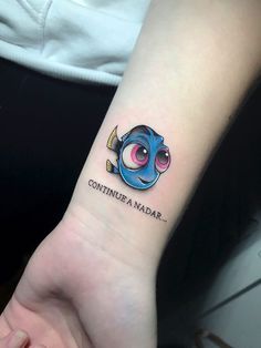 a small tattoo on the wrist that says continnea nadar with an image of a fish