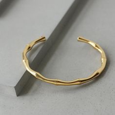 This bracelet is lightweight and easy to wear, and lend a modern edge to your jewelry wardrobe. It goes well with our BAMBOO EARRING. Material: 316L Stainless Steel, 18k Gold Plated Size: 6"-7.5" Origin: California, USA Each product packed with SOCALI premium pouch and box, together with silver cleaning cloth and card. Material Our products are made from the top-grade 316L stainless steel - a metal that is nickel-free and does not fade or blacken and 100% hypoallergenic for the benefit of those Minimalist Yellow Gold Metal Bangle, Modern Gold-plated Tarnish-resistant Bangle, Minimalist Metal Bangle Tarnish Resistant, Modern Tarnish-resistant Gold Bangle Bracelet, Gold Hoop Bangle In Minimalist Style, Minimalist Gold Hoop Bangle, Minimalist Gold-plated Yellow Gold Cuff Bracelet, Minimalist Gold Plated Round Bangle, Minimalist Gold Plated Bangle