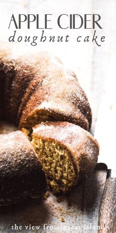 an apple cider doughnut cake cut in half