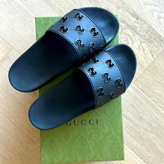 Worn Only A Few Times. Like Brand New With Only A Few Scuff Marks. Designer Black Sandals With Rubber Sole, Gucci Black Leather Slides, Gucci Designer Leather Slides, Designer Slides With Leather Sole, Luxury Slides With Rubber Sole And Round Toe, Black Leather Gucci Slides, Luxury Black Flat Slides, Black Luxury Flat Slides, Black Casual Gucci Slides