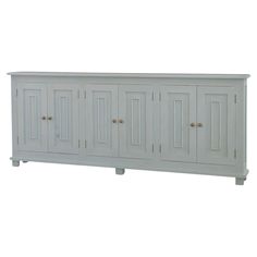 a white cabinet with four doors on the front and two drawers on the back side