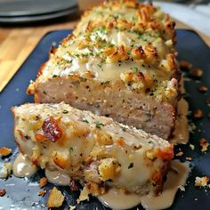 the meatloaf is covered with cheese and has been cut into slices to be eaten