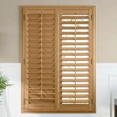 a window with wooden shutters in a room