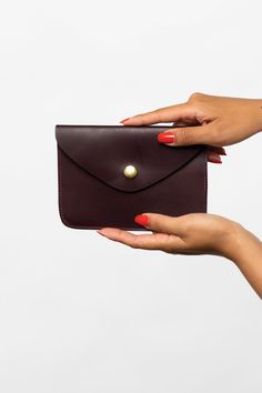 The Envelope Wallet is made of vegetable tanned leather and is secured with a steel snap. This Unisex item can be used as a simple wallet, passport holder, and even a clutch. Vegetable-tanned leather ages beautifully and is biodegradable. With proper care, this item can last for many years. It can be treated with a leather care oil to condition and clean; this process will slightly darken the leather. This artisanal product is made of genuine leather. All scars are characteristics of the skin an Simple Wallet, Thick And Fit, Envelope Wallet, Document Holder, Luxury Logo, Black Wallet, Aging Beautifully, Wallet Fashion, Leather Care