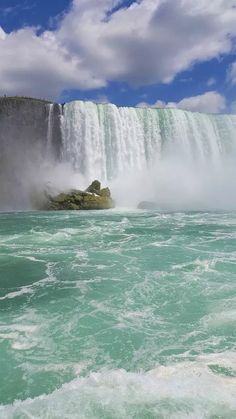 the water is green and blue as it pours into niagara falls, canada's largest waterfall