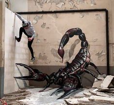 a man jumping over a giant crab in an unfinished room with peeling paint on the walls