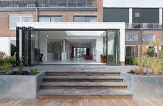 an open air living area with stairs leading up to the front door and back entrance