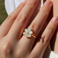 Flora 14K Solid Gold Diamond Natural Opal Blossom Ring *Metal: 14K Solid Gold (Yellow, White, or Rose) *Gemstone:      - **Opal     - Cut: Pear-Cut      - Size: 6 Pieces 4 * 6 mm     - Total Carat Weight (CTW): 2.0     - Ring Size: Available in various sizes, custom sizes upon request *Diamonds:    - Color: Gold   - Clarity: VS    - Total Carat Weight (CTW): 0.02 Flora 14K Solid Gold Diamond Natural Opal Blossom Ring is a stunning celebration of nature's delicate beauty. Inspired by the enchanti Luxury Unique Yellow Gold Opal Ring, Luxury Yellow Gold Opal Ring Collectible, Luxury Gold Opal Ring Hallmarked, Elegant Multi-stone Opal Ring In 14k Gold, Luxury Multi-stone Opal Ring In 14k Gold, Natural Opal Ring, Opal Diamond Ring, Birthday Ring, Natural Opal